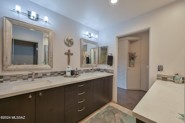 bathroom with decorative backsplash and vanity