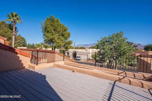 wooden deck featuring a mountain view