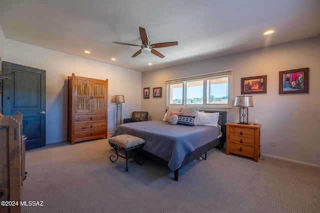 bedroom featuring ceiling fan and light colored carpet