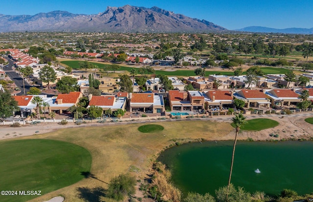 bird's eye view with a water and mountain view