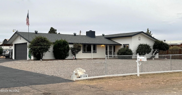 single story home with a garage