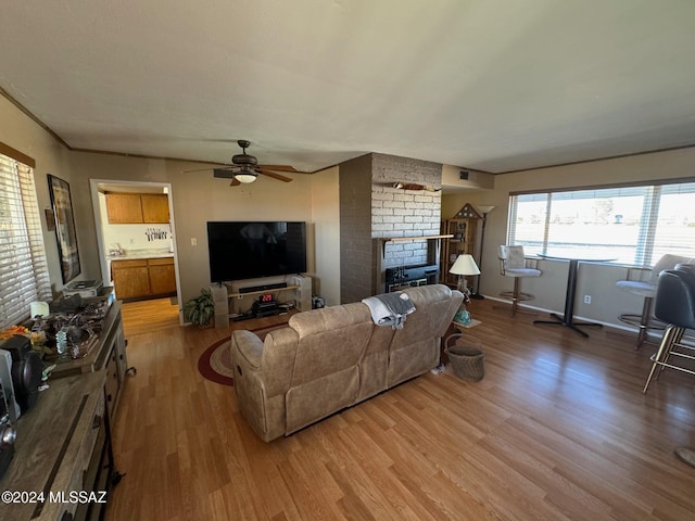 living room with hardwood / wood-style floors and ceiling fan