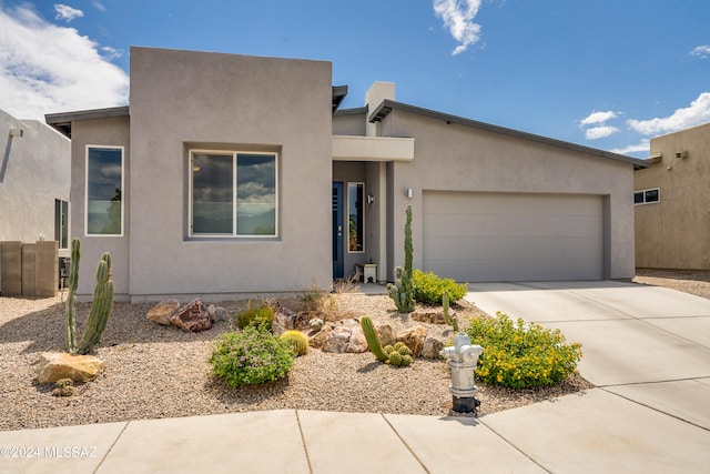 adobe home featuring a garage