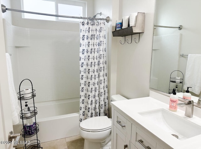 full bathroom featuring toilet, vanity, tile patterned floors, and shower / bath combo with shower curtain