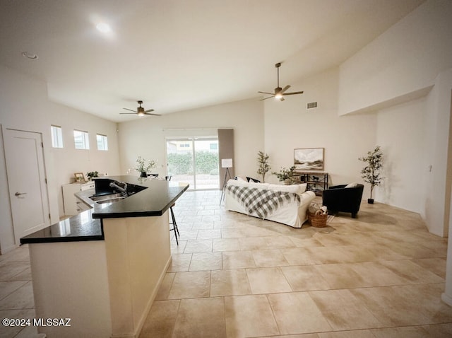 interior space with sink, access to outside, and vaulted ceiling