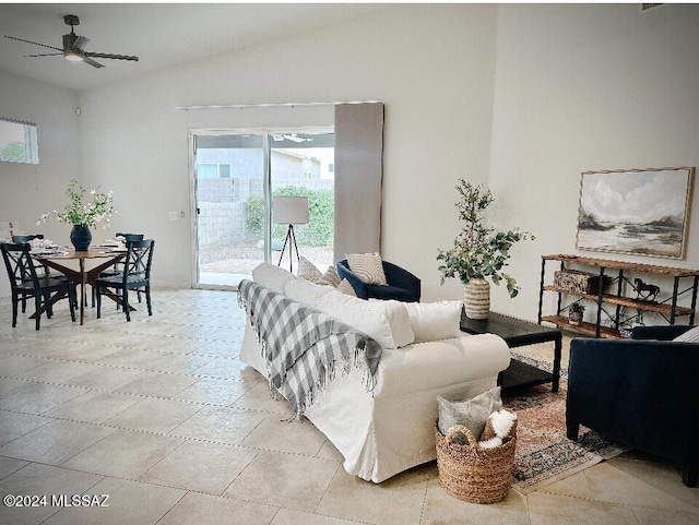 living room with ceiling fan and lofted ceiling