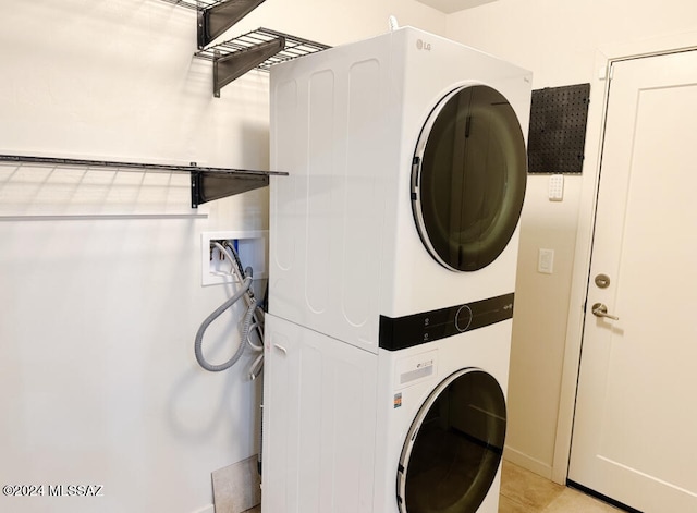 laundry room featuring stacked washer / dryer