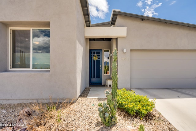 entrance to property featuring a garage