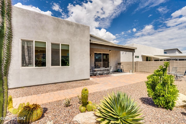 rear view of property featuring a patio