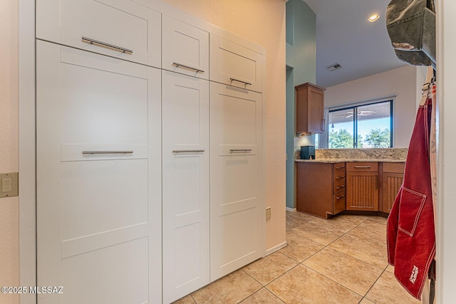 kitchen with light tile patterned floors