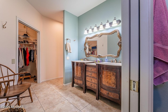 bathroom with tile patterned flooring and vanity