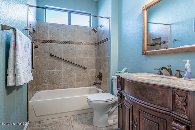 full bathroom featuring tiled shower / bath combo, vanity, and toilet