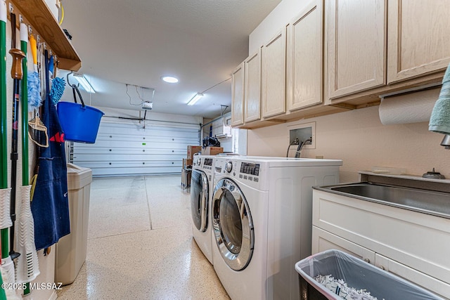 laundry area featuring cabinets and independent washer and dryer