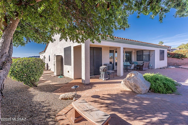 rear view of house with a patio area