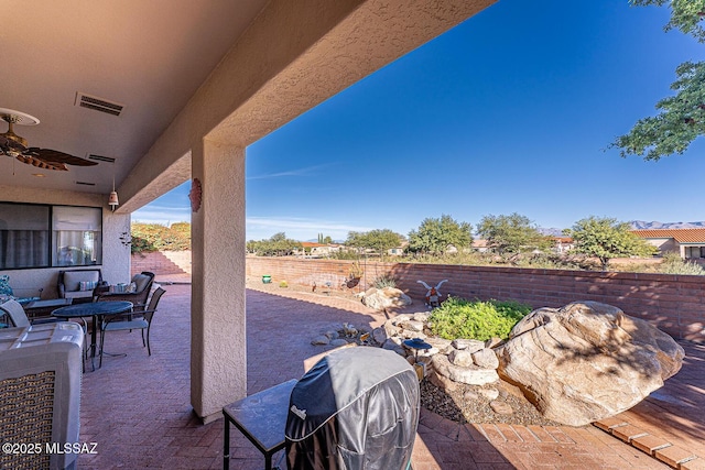 view of patio featuring an outdoor hangout area, grilling area, and ceiling fan