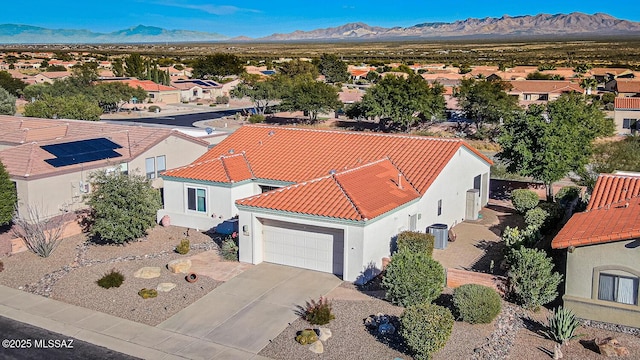 birds eye view of property featuring a mountain view