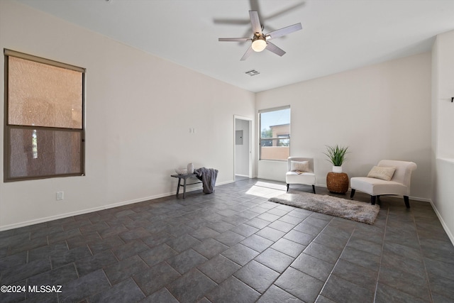 unfurnished room with visible vents, baseboards, and ceiling fan