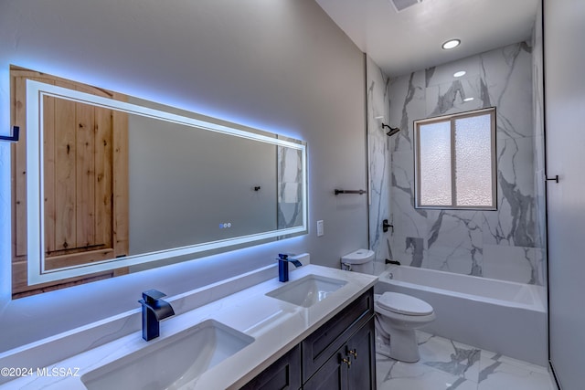 full bathroom with vanity, tiled shower / bath combo, and toilet