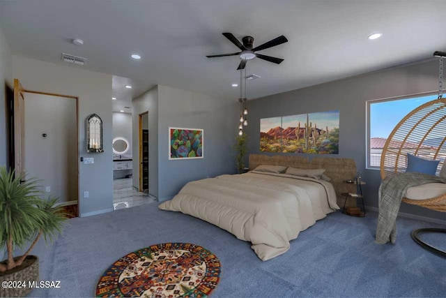 bedroom featuring carpet, connected bathroom, and ceiling fan