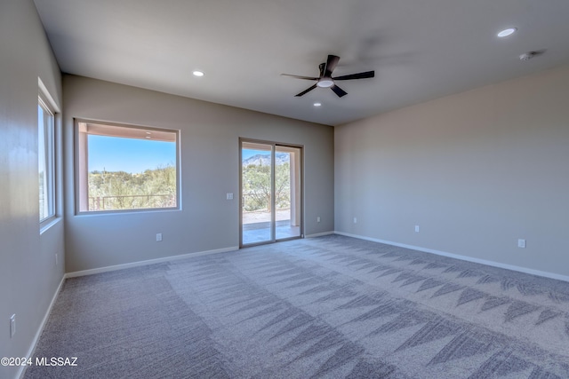 empty room featuring carpet and ceiling fan