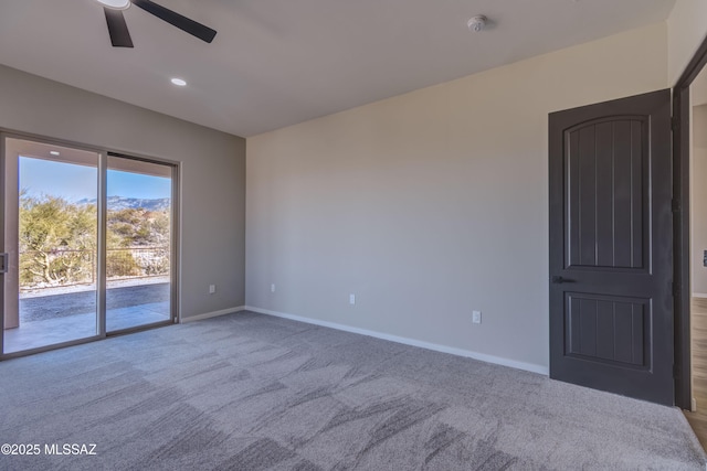 empty room with ceiling fan and carpet