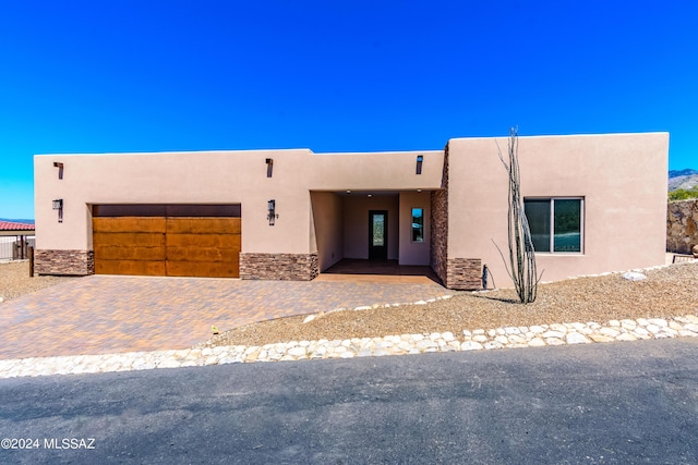 southwest-style home with a garage