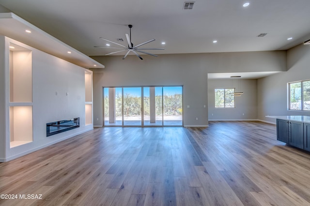 unfurnished living room with light wood-type flooring