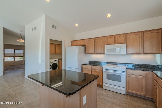 kitchen featuring hanging light fixtures, washer / dryer, dark stone counters, lofted ceiling, and white appliances