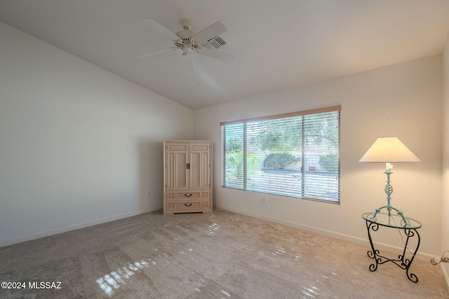 unfurnished bedroom with light colored carpet and vaulted ceiling