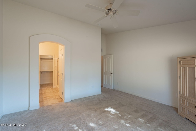 carpeted empty room with ceiling fan