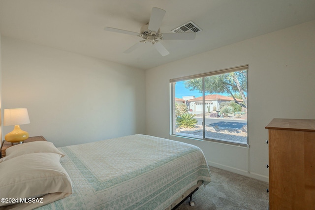 carpeted bedroom with ceiling fan