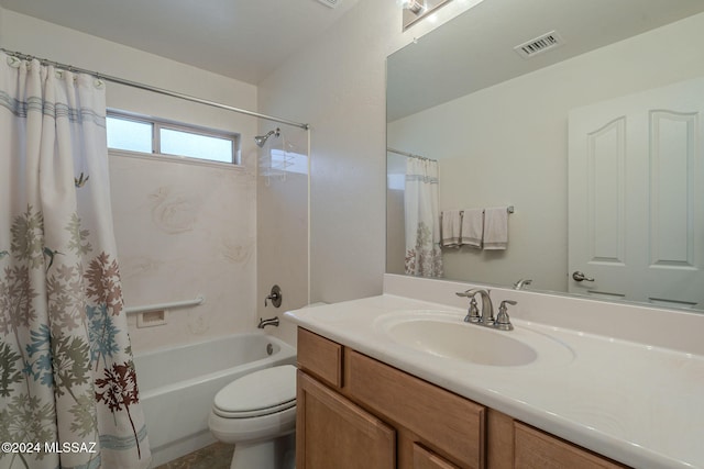 full bathroom with shower / tub combo, vanity, and toilet