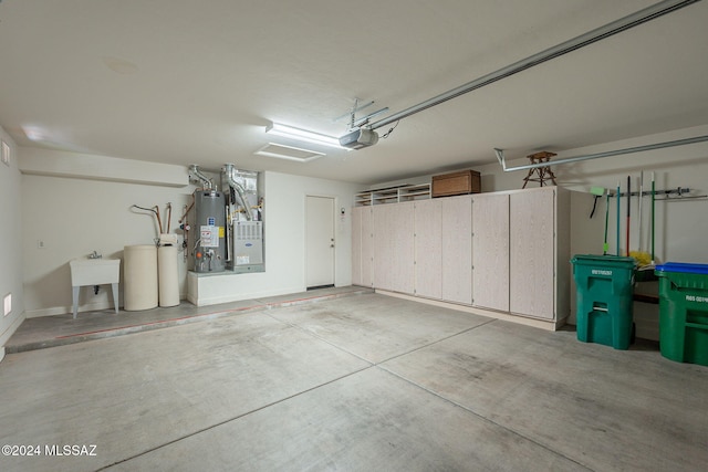 garage with sink, a garage door opener, and water heater