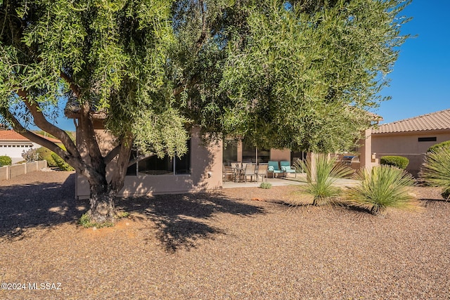 rear view of property with a patio