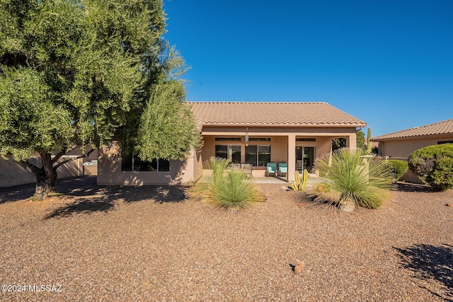 rear view of house with a patio