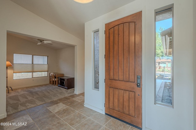 foyer featuring ceiling fan and vaulted ceiling