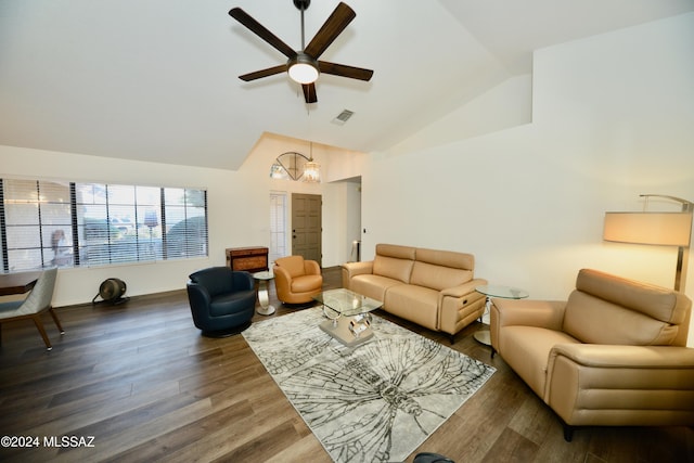 living room with ceiling fan with notable chandelier, dark hardwood / wood-style floors, and high vaulted ceiling