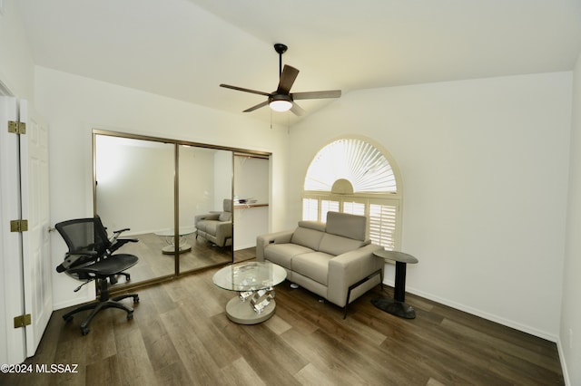 living room with lofted ceiling, ceiling fan, baseboards, and wood finished floors