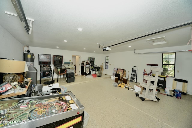 interior space featuring a garage door opener and water heater