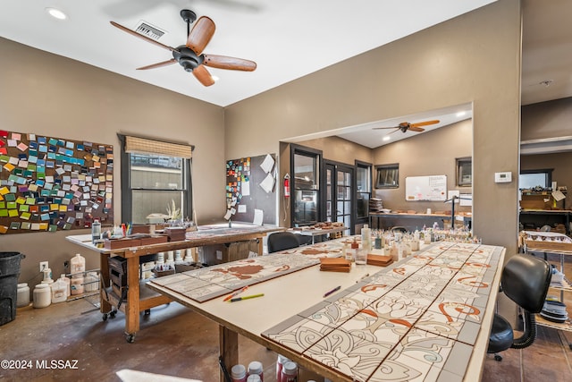 dining area featuring ceiling fan and lofted ceiling