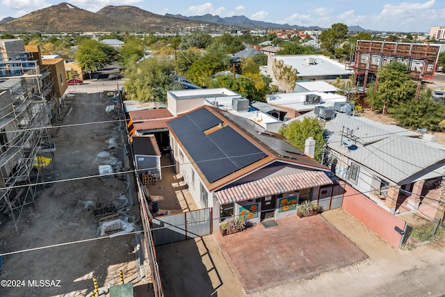 birds eye view of property with a mountain view