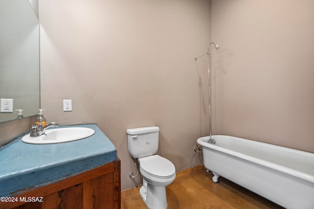 bathroom with vanity, toilet, and a bath