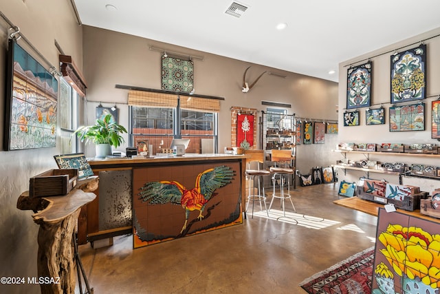 bar featuring concrete flooring