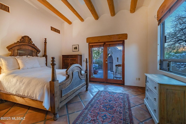 tiled bedroom featuring beamed ceiling, access to exterior, and french doors