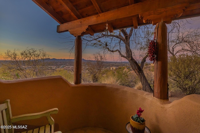 balcony at dusk with a mountain view