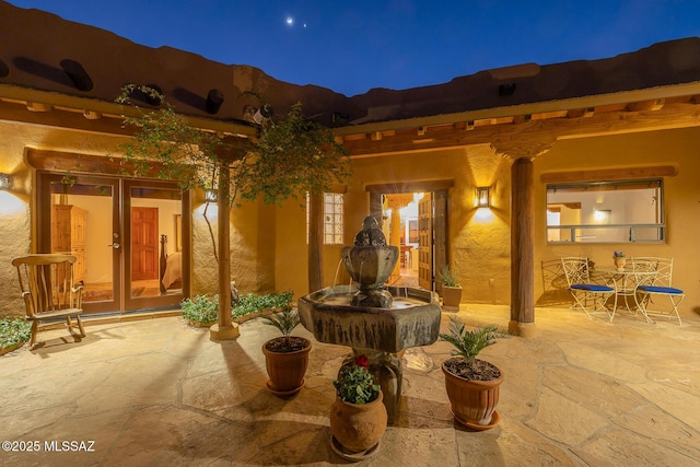 view of patio at twilight