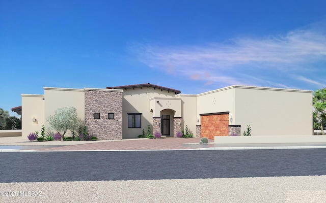 mediterranean / spanish-style home with stone siding and stucco siding