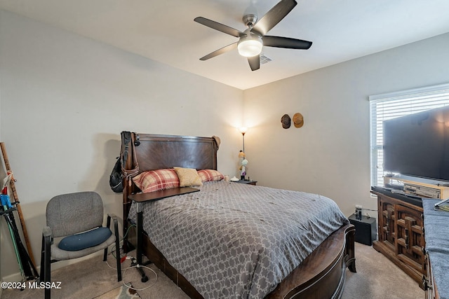 bedroom with ceiling fan and light colored carpet