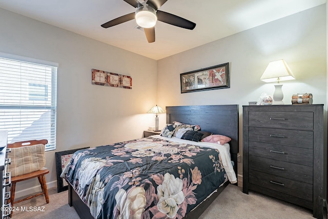 carpeted bedroom featuring ceiling fan