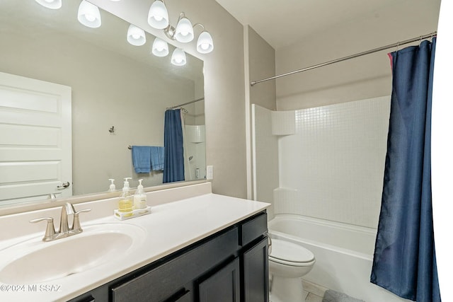 full bathroom with tile patterned floors, vanity, toilet, and shower / bath combo with shower curtain